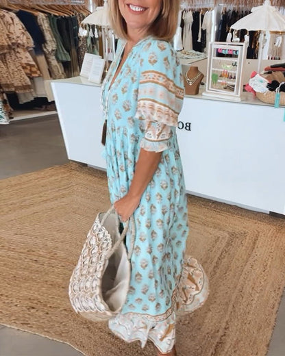 Mana | Vestido midi chic con estampado floral y escote en V