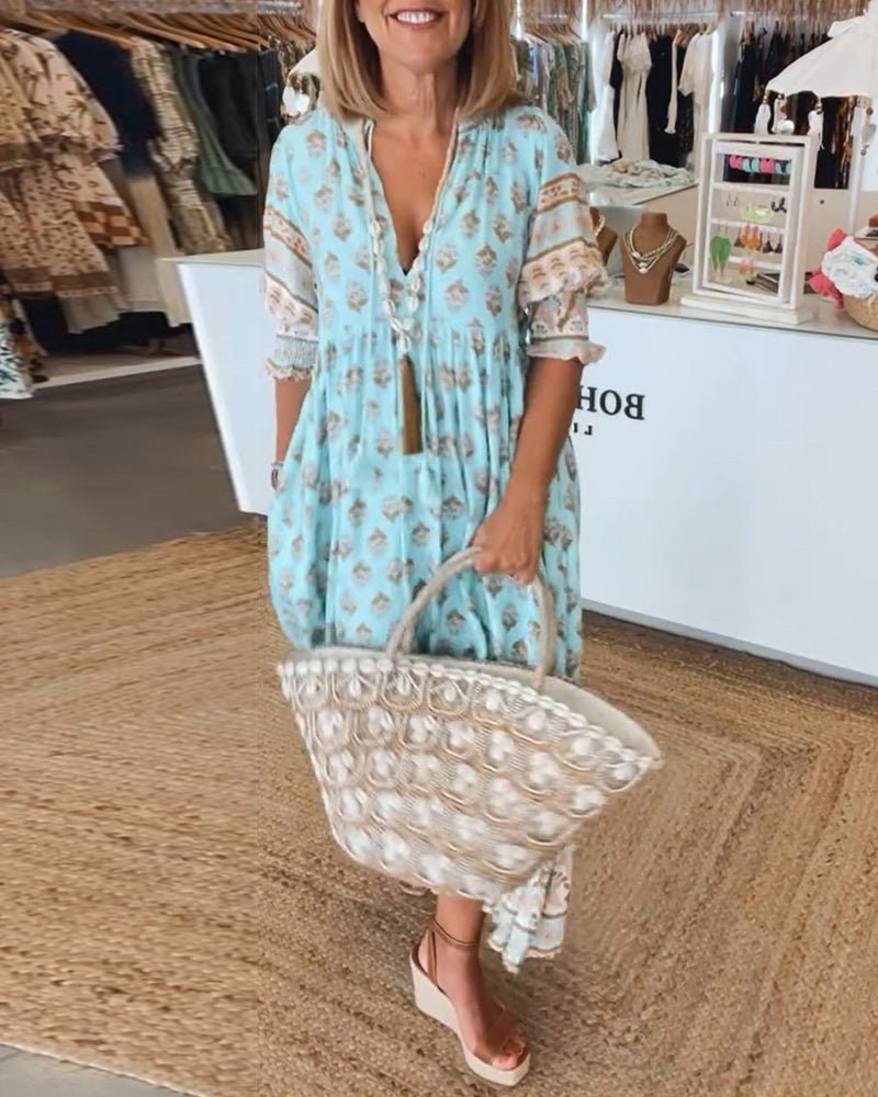 Mana | Vestido midi chic con estampado floral y escote en V