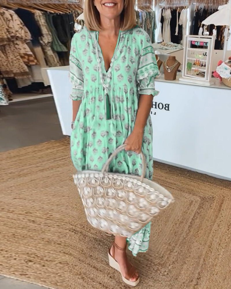 Mana | Vestido midi chic con estampado floral y escote en V