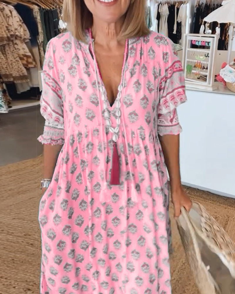 Mana | Vestido midi chic con estampado floral y escote en V