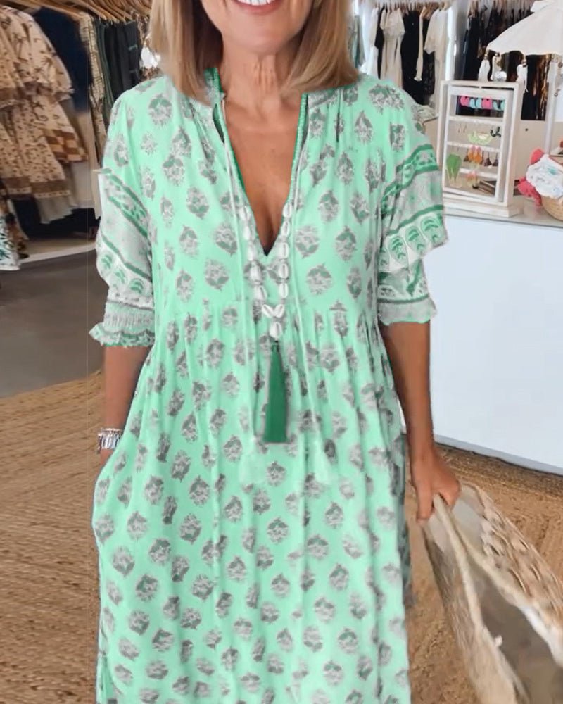 Mana | Vestido midi chic con estampado floral y escote en V