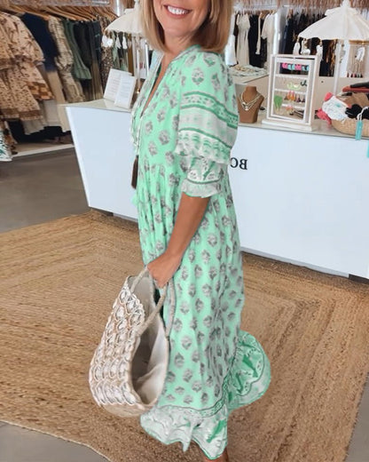 Mana | Vestido midi chic con estampado floral y escote en V