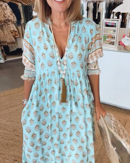 Mana | Vestido midi chic con estampado floral y escote en V